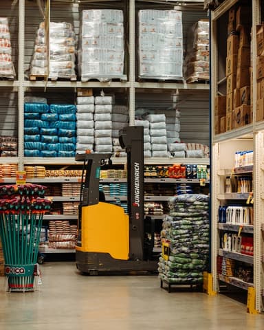 Forklift moving pallets in a warehouse