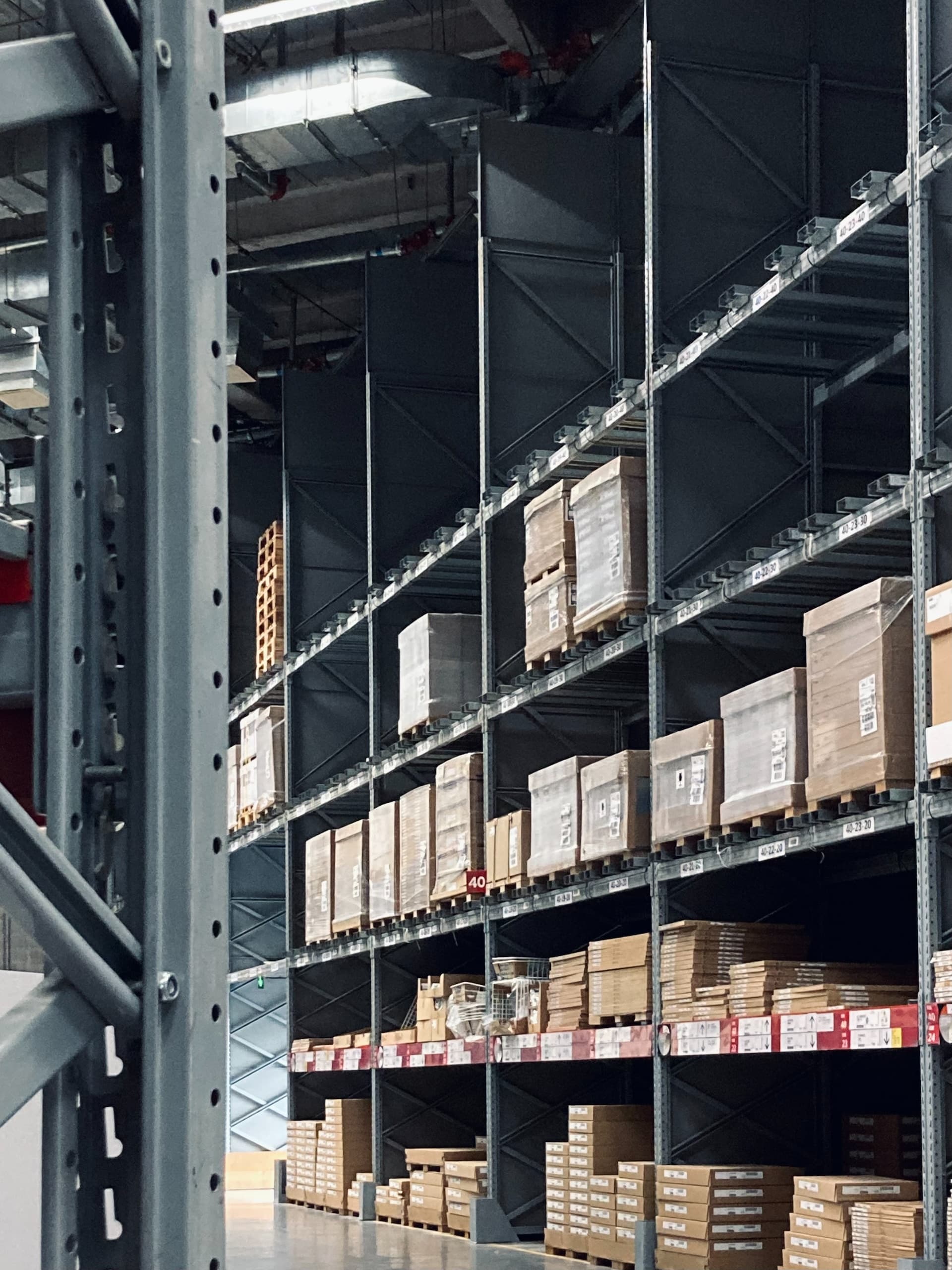 Warehouse aisle with racked inventory